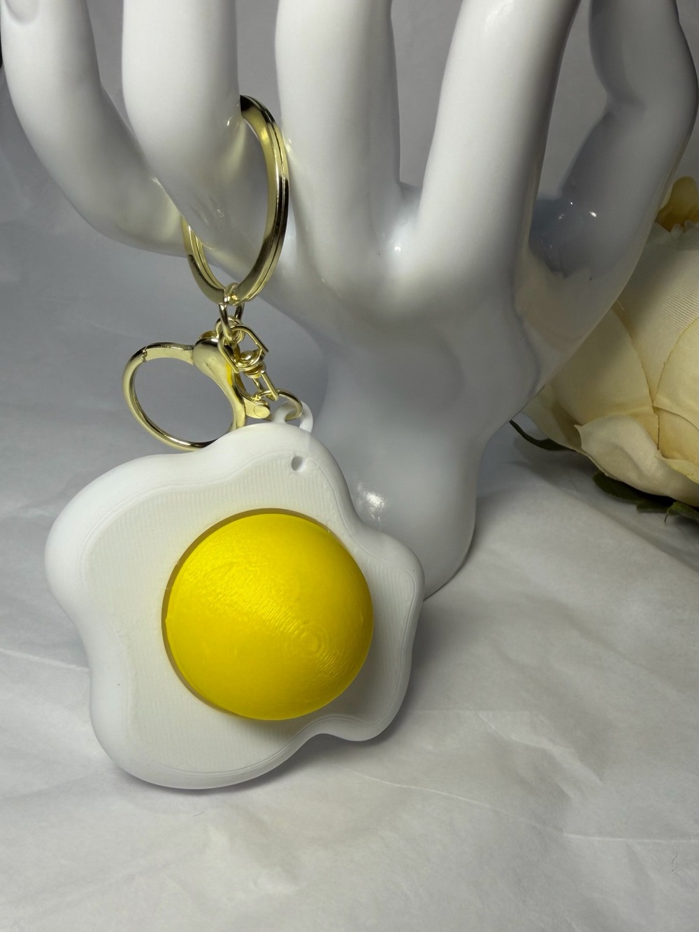 Egg-Shaped Fidget Clicker Keychain with Gold Hardware